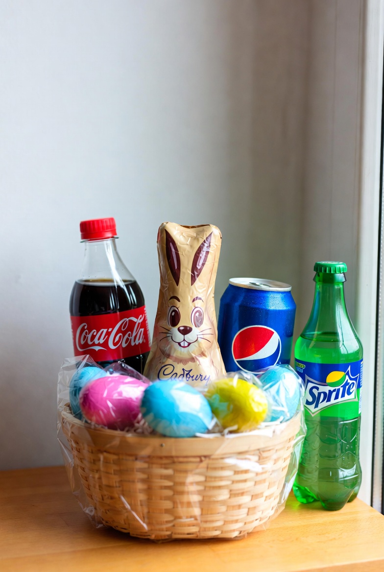 Easter basket with chocolate bunny and sodas Easter basket with chocolate bunny and sodas