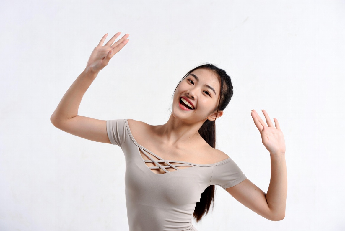 Asian woman waving happily Asian woman waving happily