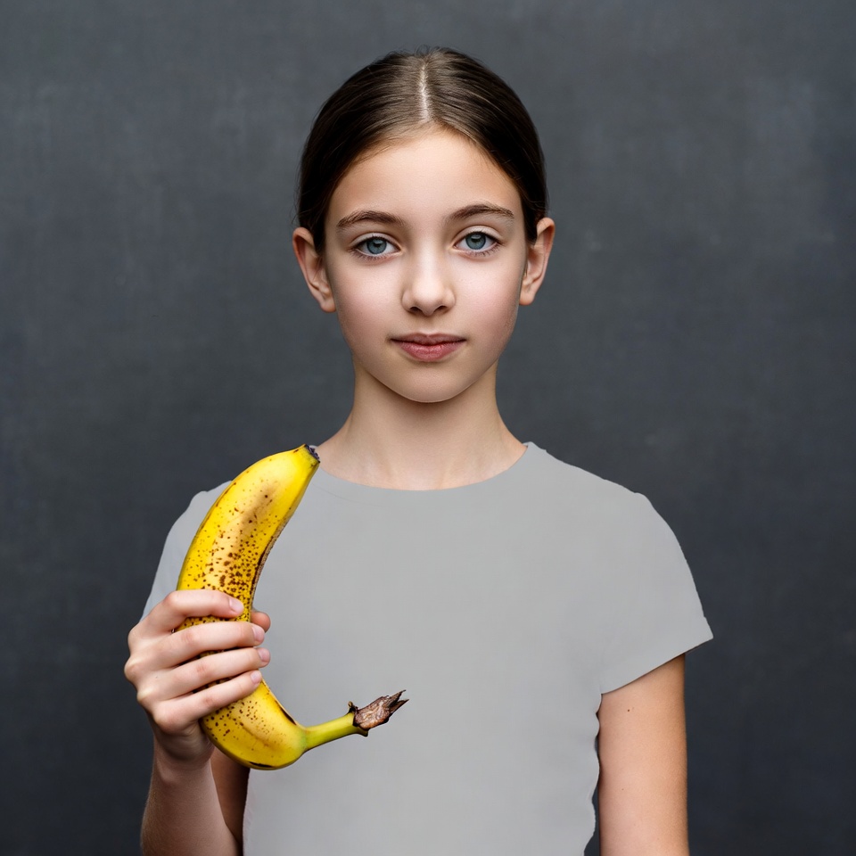 Girl holding yellow banana Girl holding yellow banana