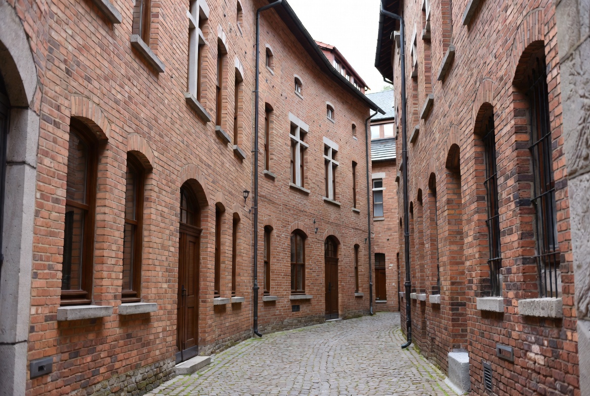 Narrow Cobblestone Alley Between Brick Buildings Narrow Cobblestone Alley Between Brick Buildings