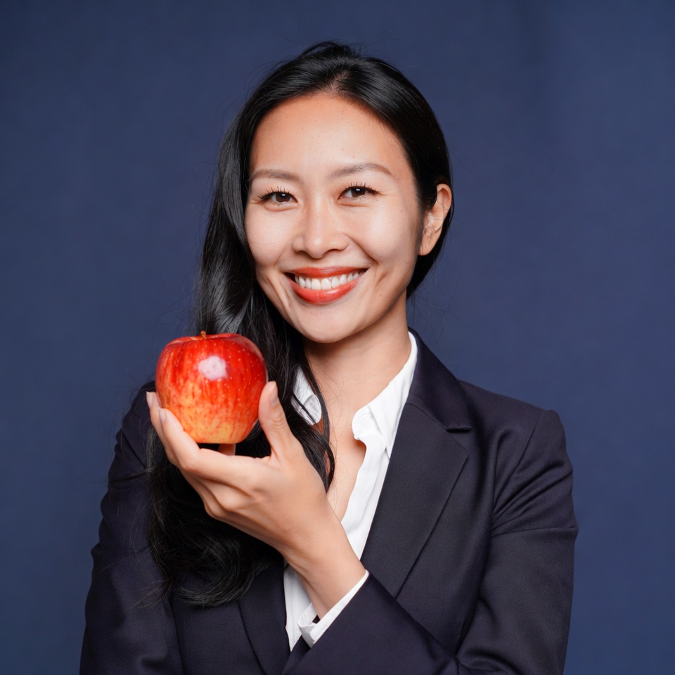 Asian woman holding red apple Asian woman holding red apple