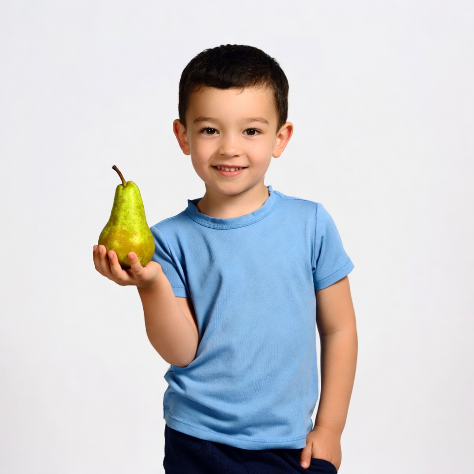 Boy holding green pear Boy holding green pear