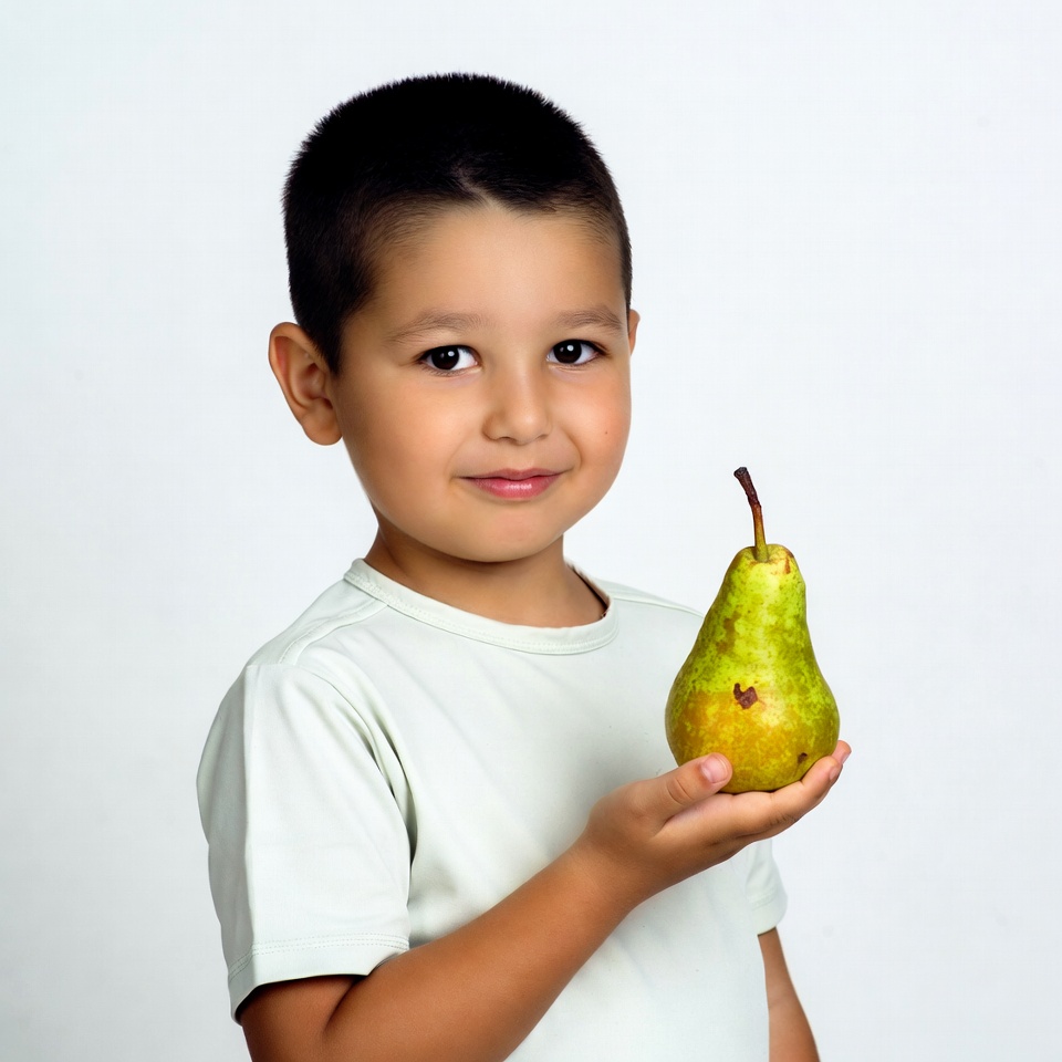 Boy holding green pear Boy holding green pear