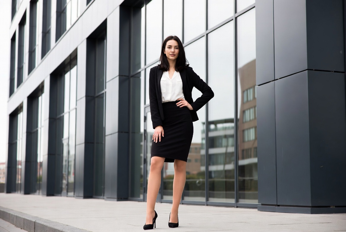 Business woman in suit outside building Business woman in suit outside building