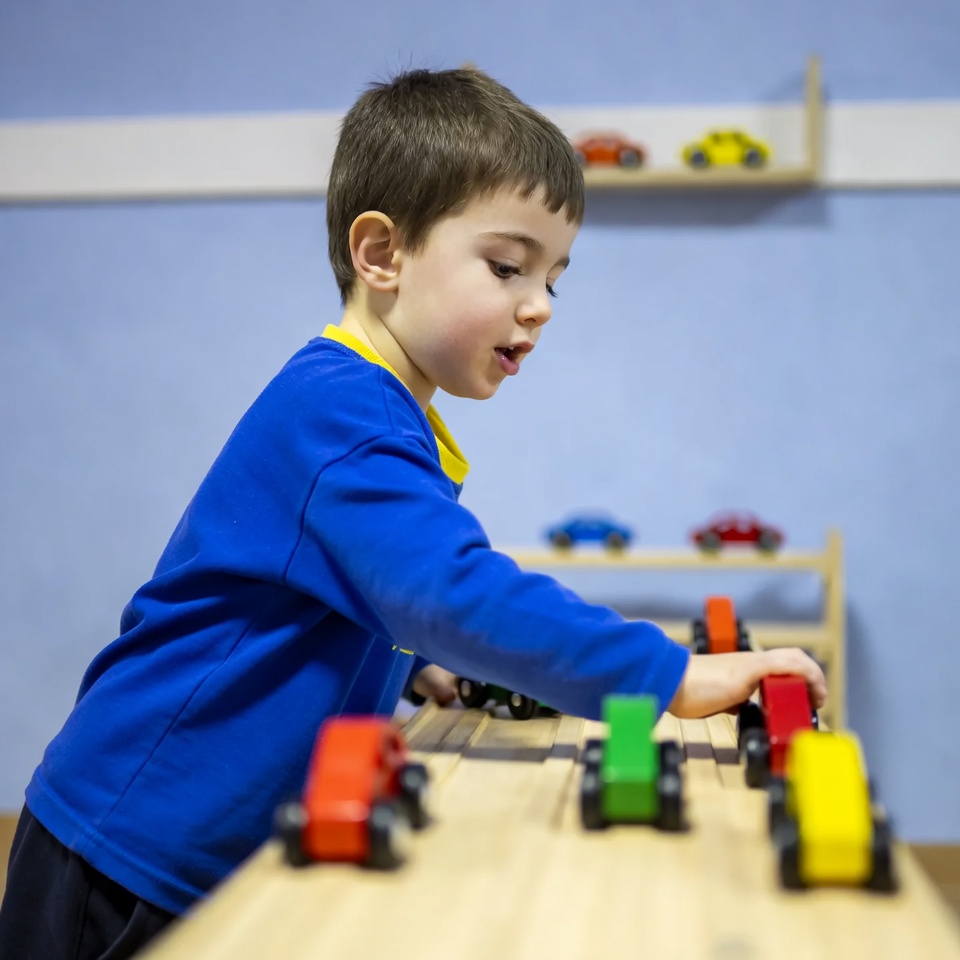 Boy playing with toy cars Boy playing with toy cars
