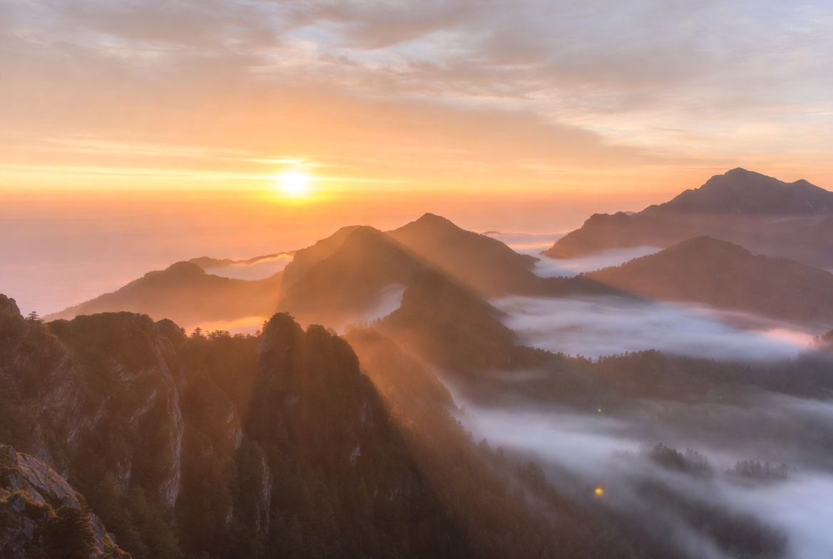 Sunrise over Mountain Peaks with Fog Sunrise over Mountain Peaks with Fog