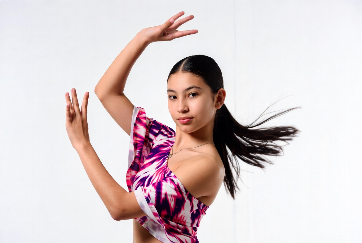 Asian girl dancing in pink ruffle top Asian girl dancing in pink ruffle top