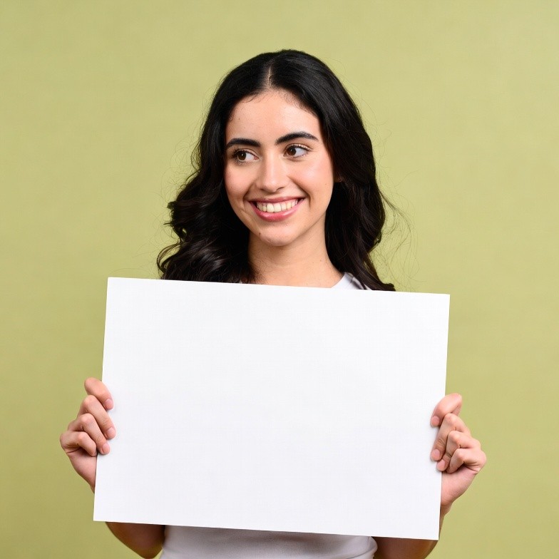 Smiling woman holding blank sign Smiling woman holding blank sign