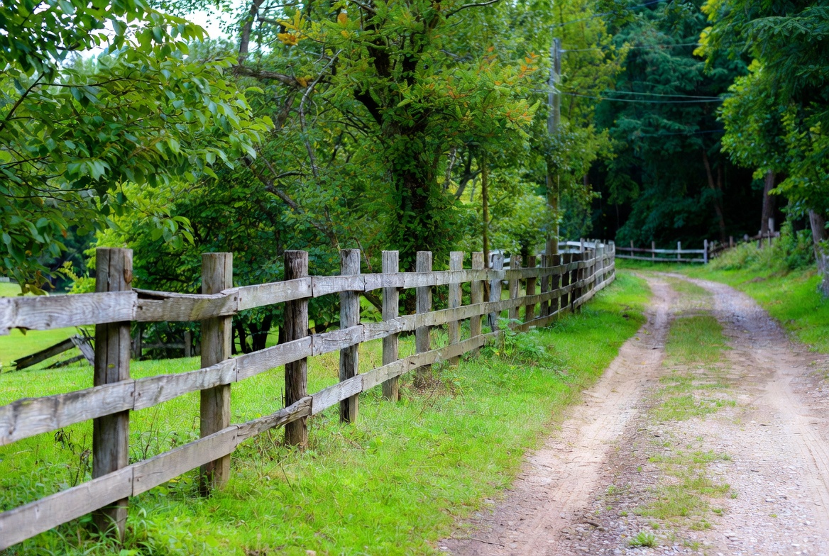 Wooden Fence Along Country Dirt Path Wooden Fence Along Country Dirt Path