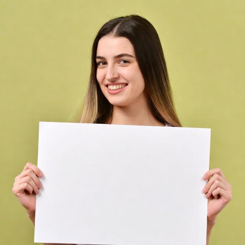 Smiling woman holding blank sign Smiling woman holding blank sign