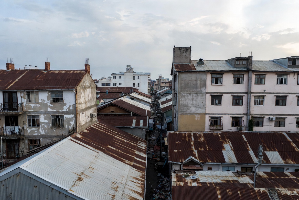 Rusty Rooftop Alley in Urban Slum Rusty Rooftop Alley in Urban Slum