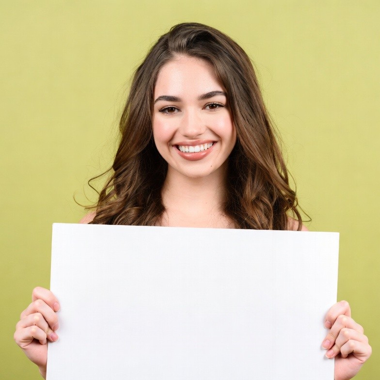 Smiling woman holding blank sign Smiling woman holding blank sign