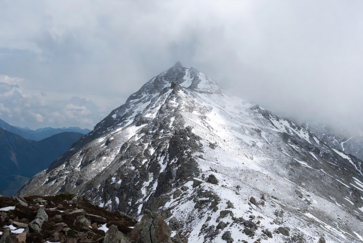 Snowy Mountain Peak in Clouds Snowy Mountain Peak in Clouds