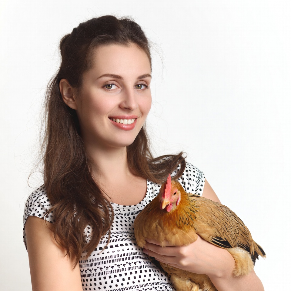 Woman holding chicken Woman holding chicken
