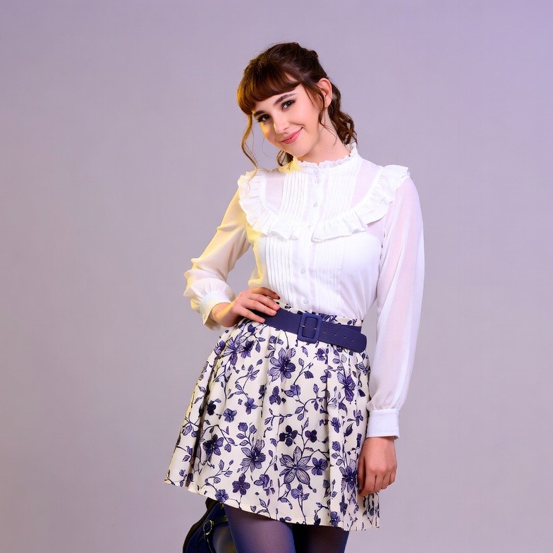 Smiling woman in white blouse skirt Smiling woman in white blouse skirt