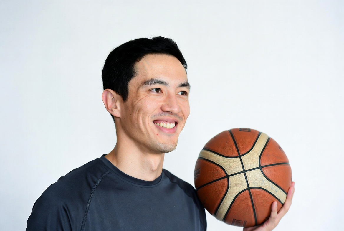 Asian man holding basketball Asian man holding basketball