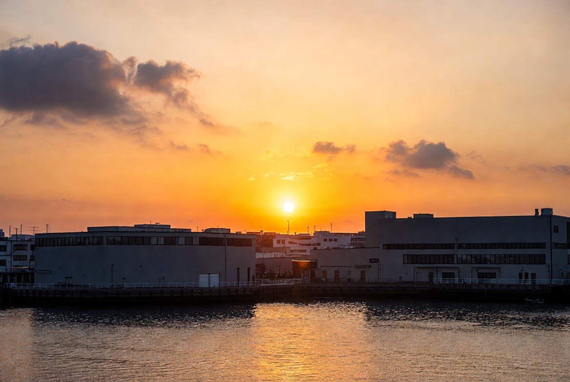 Sunset over industrial harbor buildings Sunset over industrial harbor buildings