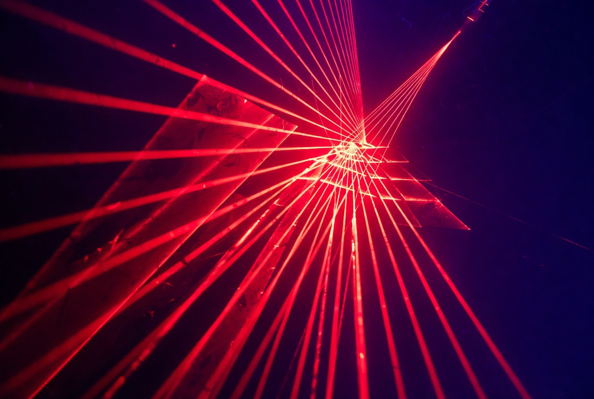 Red laser beams forming pyramid Red laser beams forming pyramid