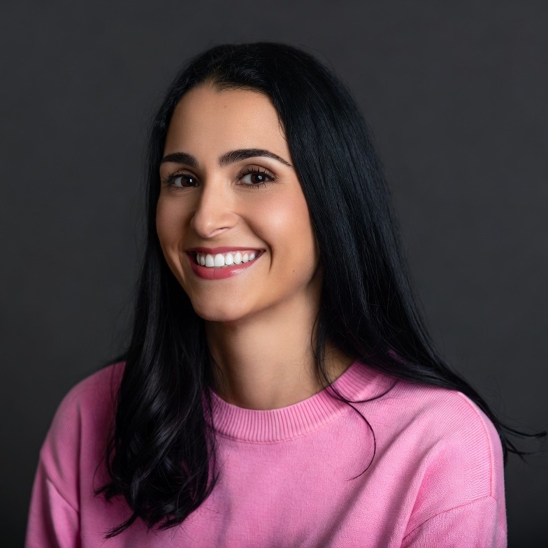 Smiling woman in pink sweater Smiling woman in pink sweater