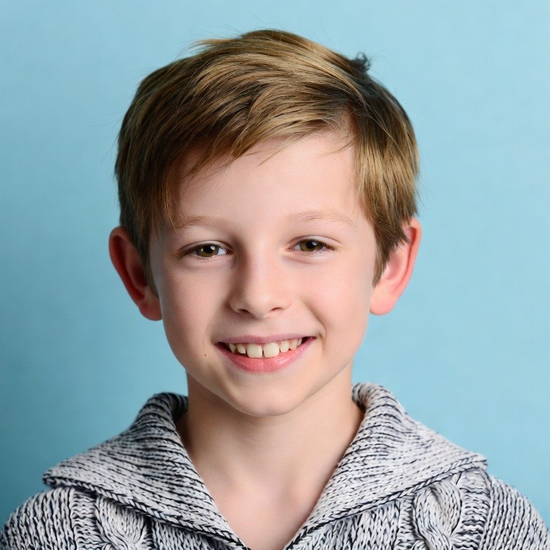 Smiling boy with short brown hair Smiling boy with short brown hair