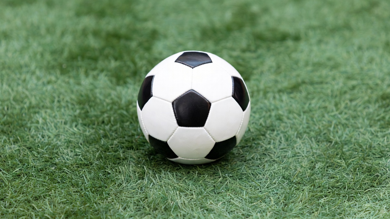 Soccer Ball on Green Grass Soccer Ball on Green Grass