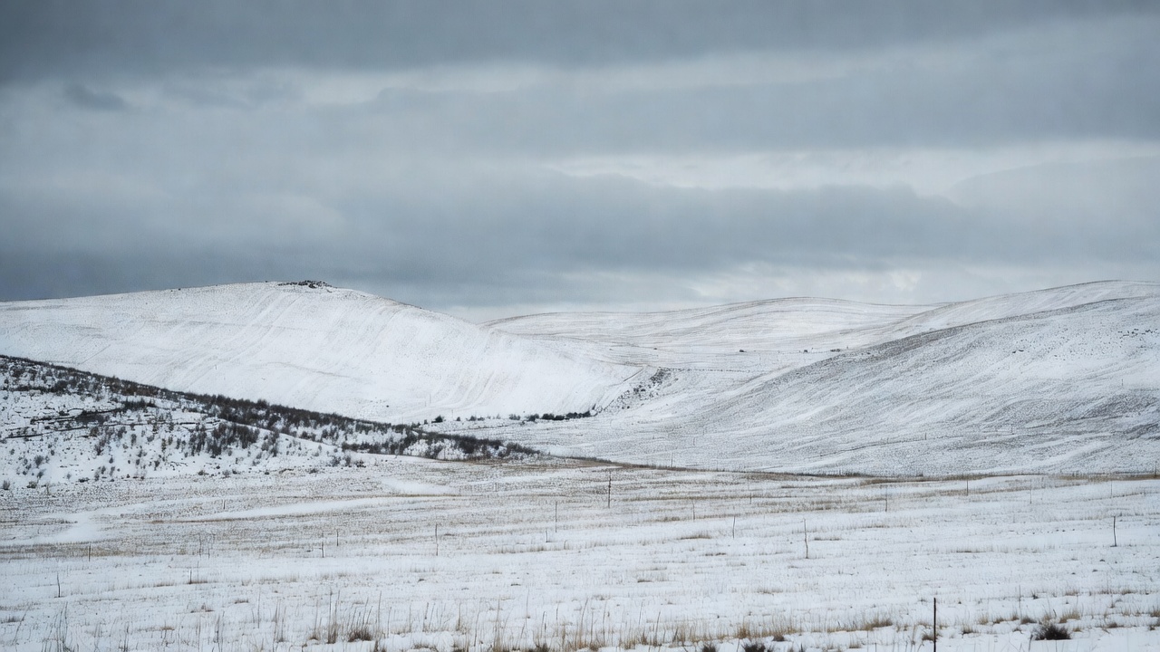 Snowy Hills Under Gray Clouds Snowy Hills Under Gray Clouds