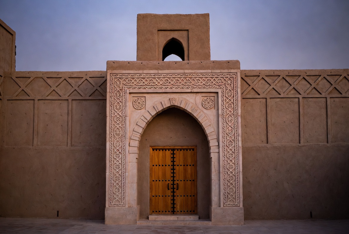 Traditional Mudbrick Archway with Wooden Door Traditional Mudbrick Archway with Wooden Door