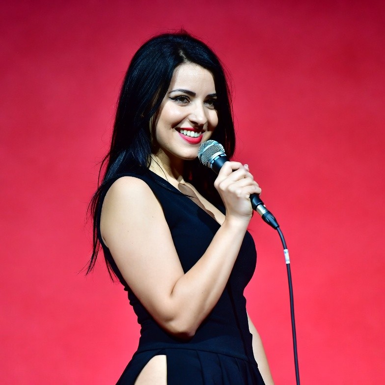 Woman singing with microphone Woman singing with microphone