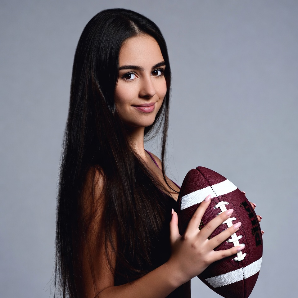 Woman holding football Woman holding football