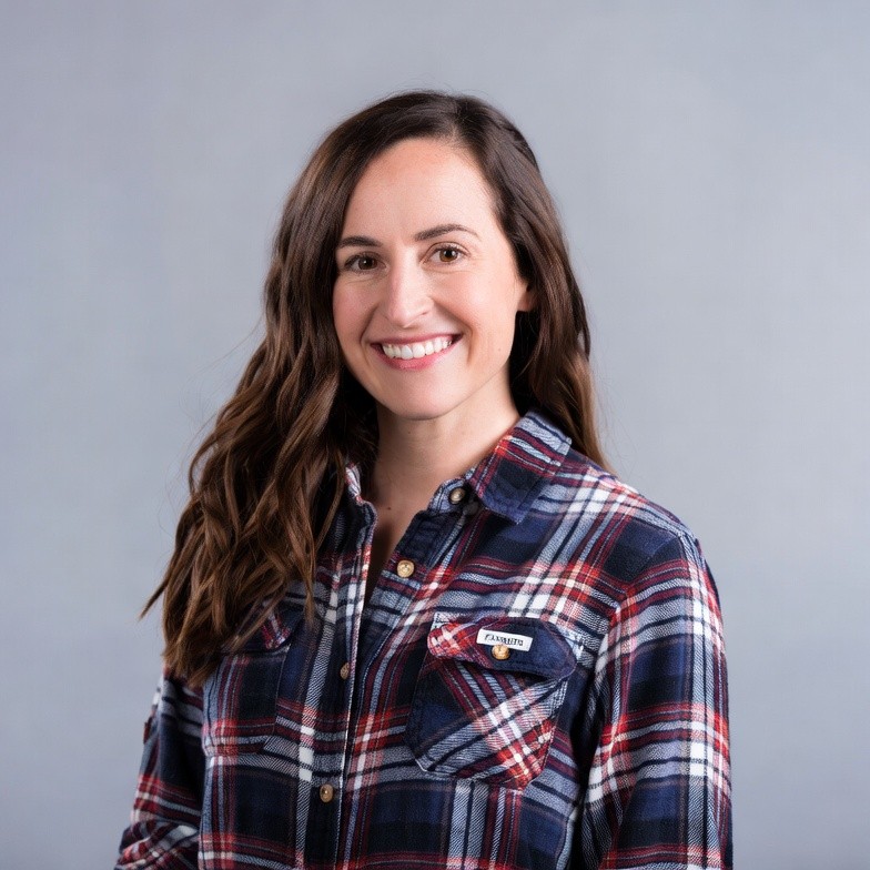 Smiling woman in plaid shirt Smiling woman in plaid shirt