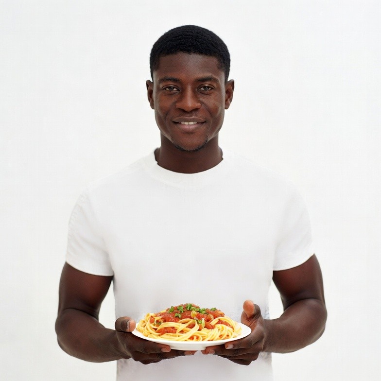 African-American man holding spaghetti plate African-American man holding spaghetti plate