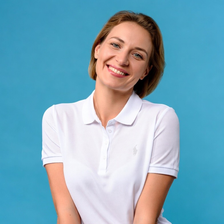 Smiling woman in white polo shirt Smiling woman in white polo shirt