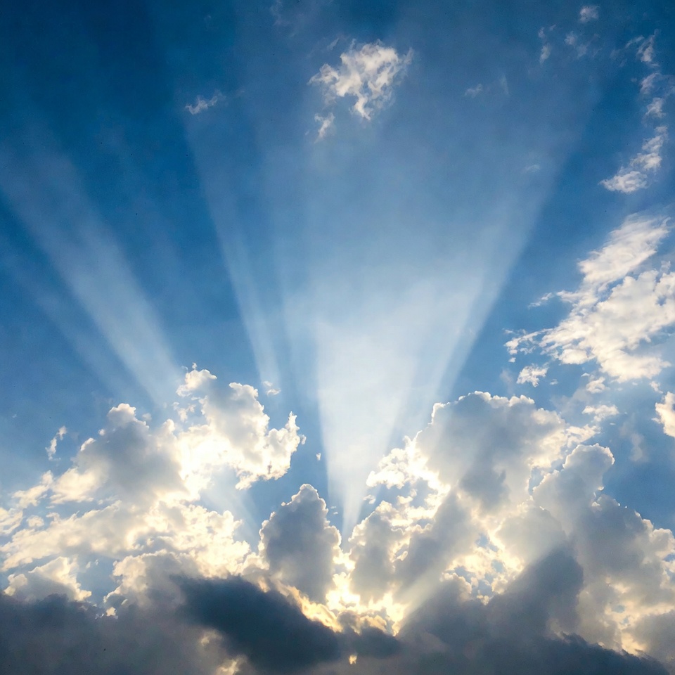 Sun rays beaming through clouds Sun rays beaming through clouds
