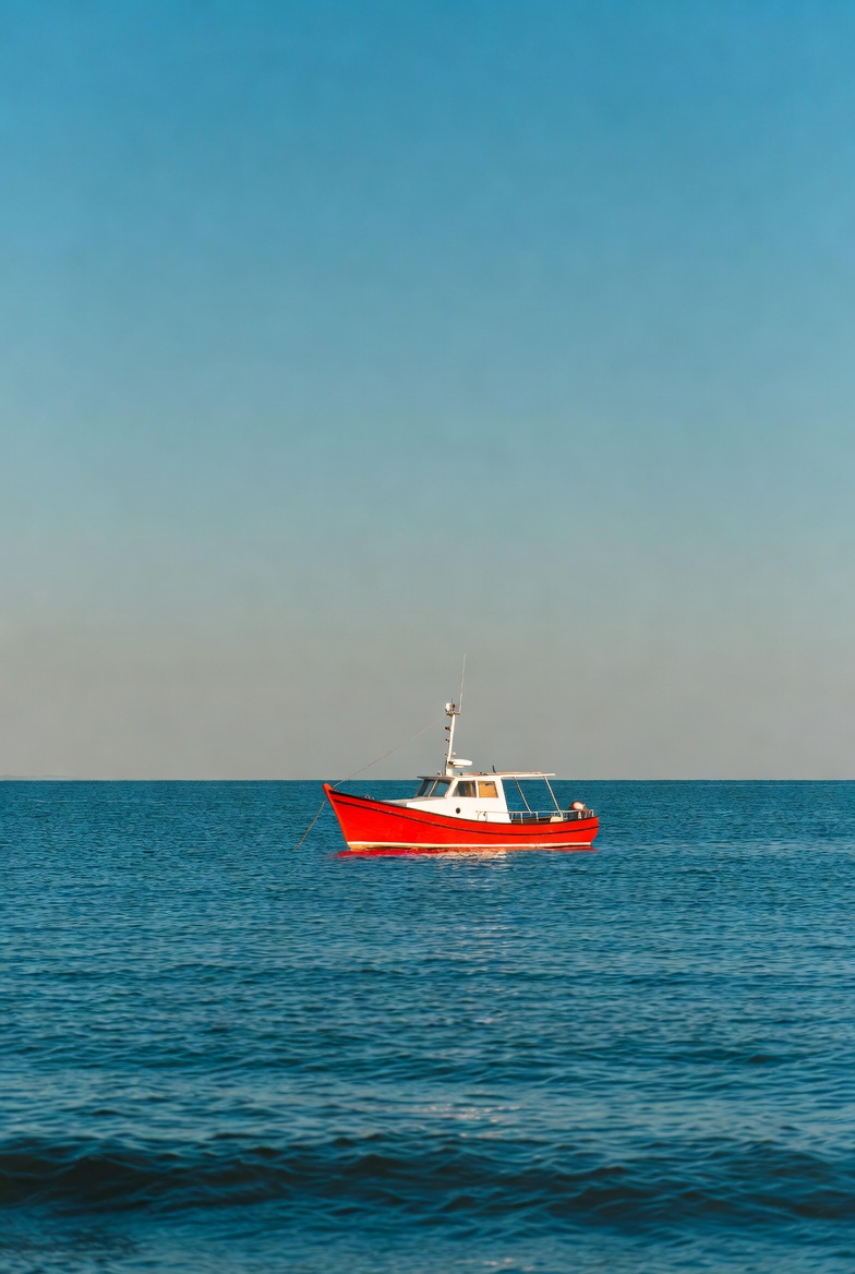 Red Fishing Boat on Ocean Red Fishing Boat on Ocean
