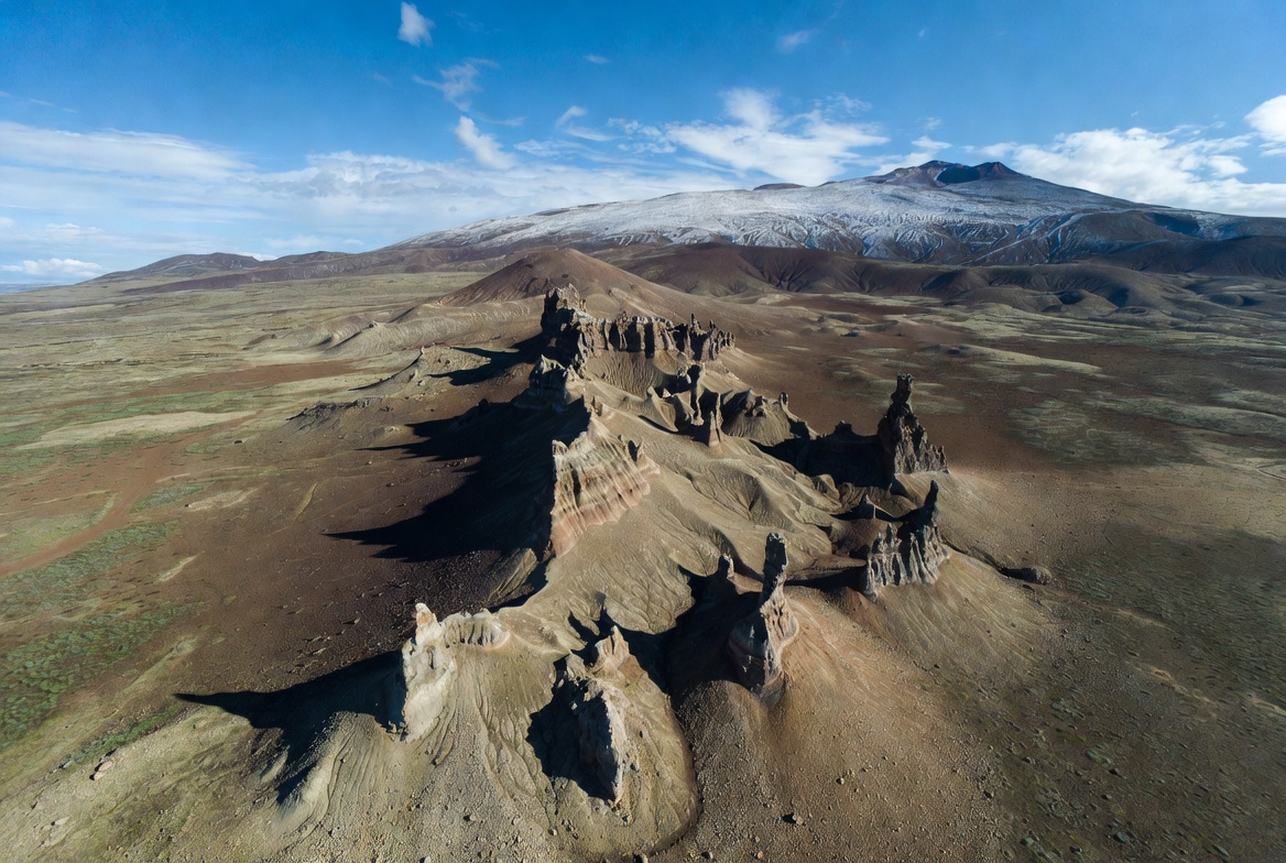Aerial View Eroded Rock Formations Snowy Mountain Aerial View Eroded Rock Formations Snowy Mountain