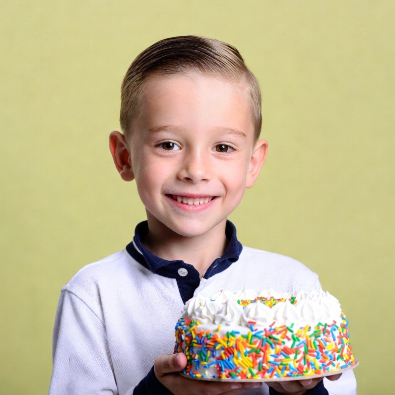 Boy holding birthday cake Boy holding birthday cake