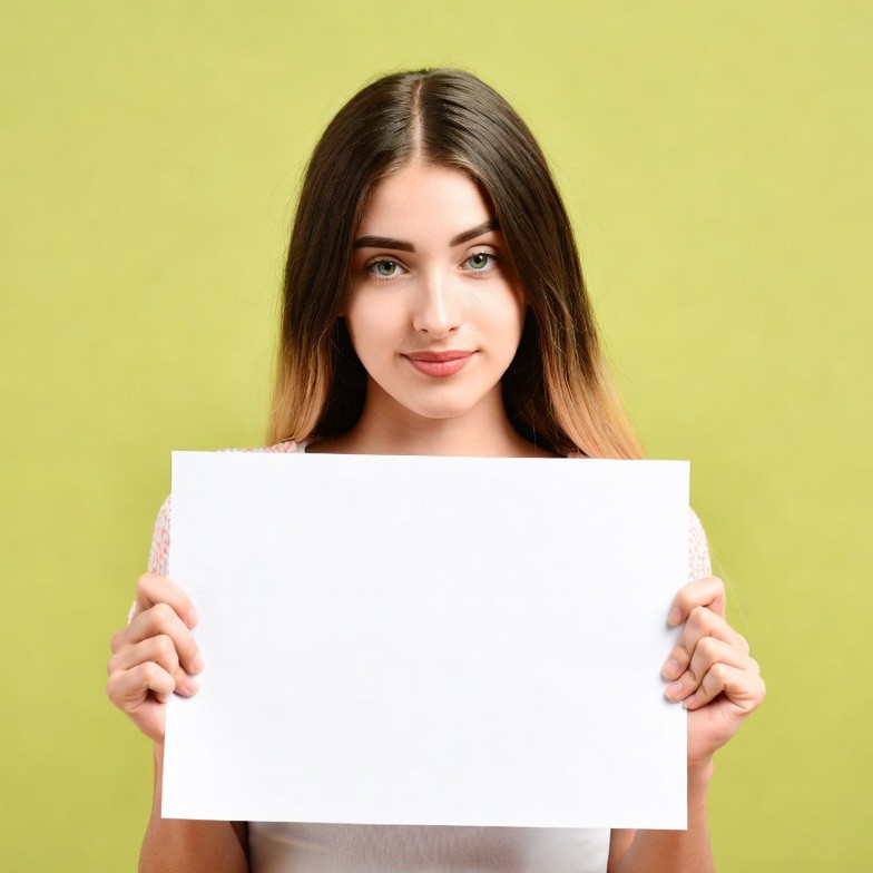 Woman holding blank sign Woman holding blank sign