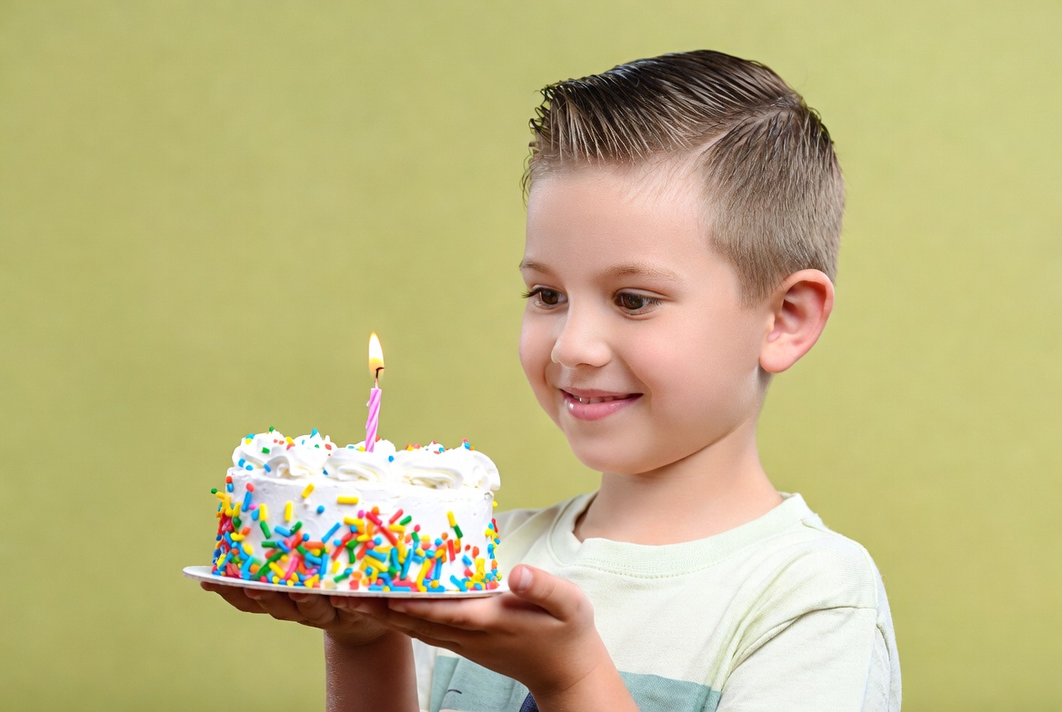 Boy holding birthday cake Boy holding birthday cake