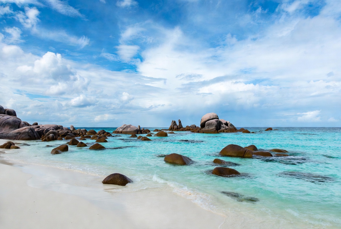 Granite boulders on tropical beach Granite boulders on tropical beach