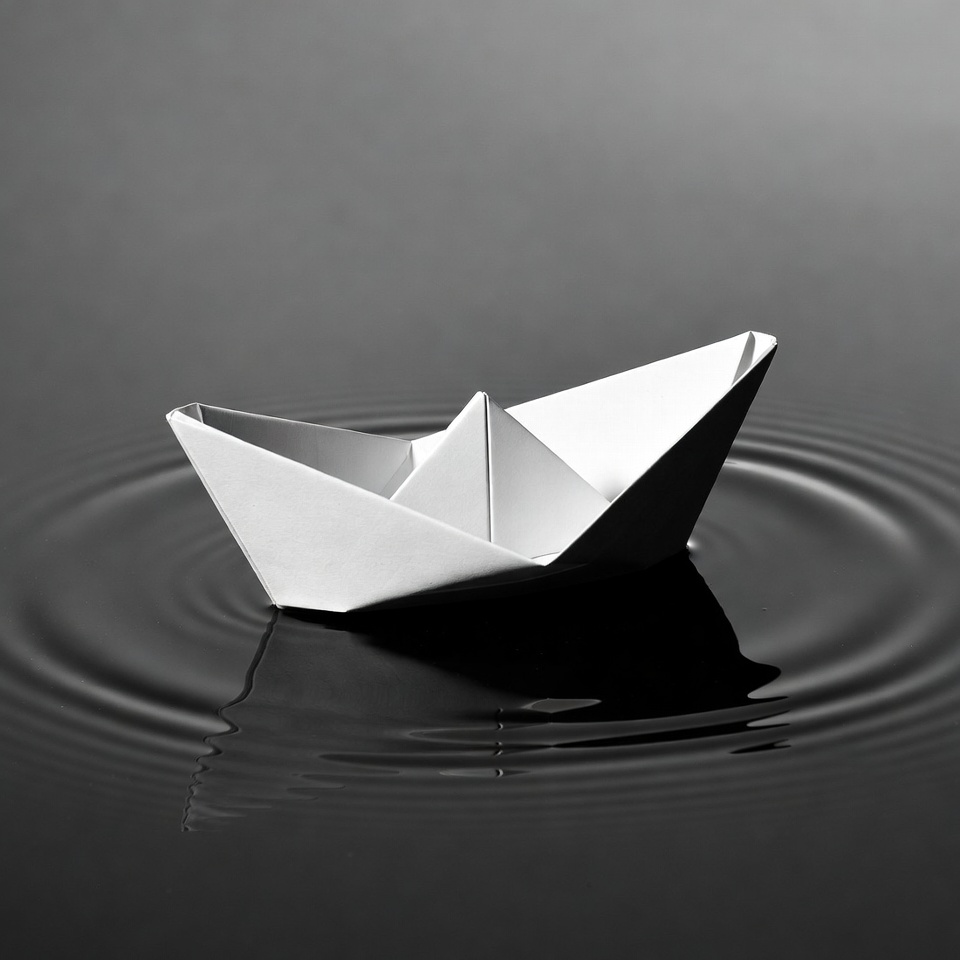 Paper Boat Floating on Water Paper Boat Floating on Water