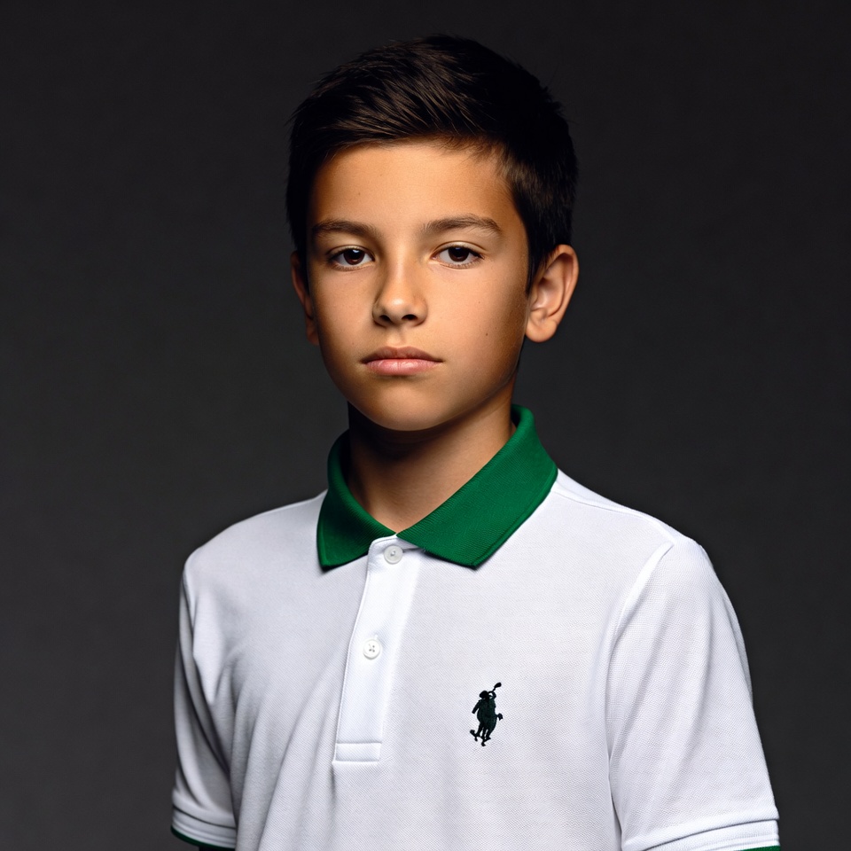 Boy in white polo shirt Boy in white polo shirt