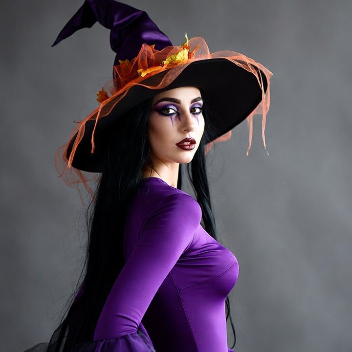 Woman in purple witch costume Woman in purple witch costume