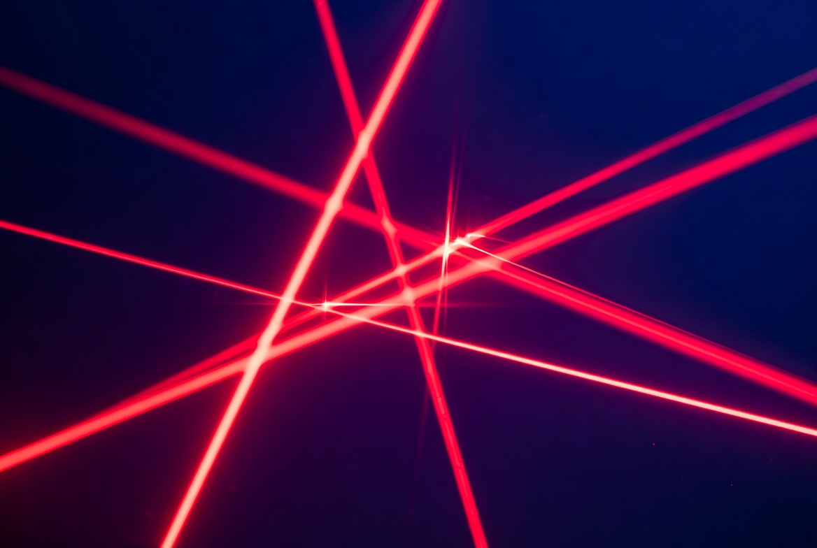 Red Laser Beams on Dark Background Red Laser Beams on Dark Background