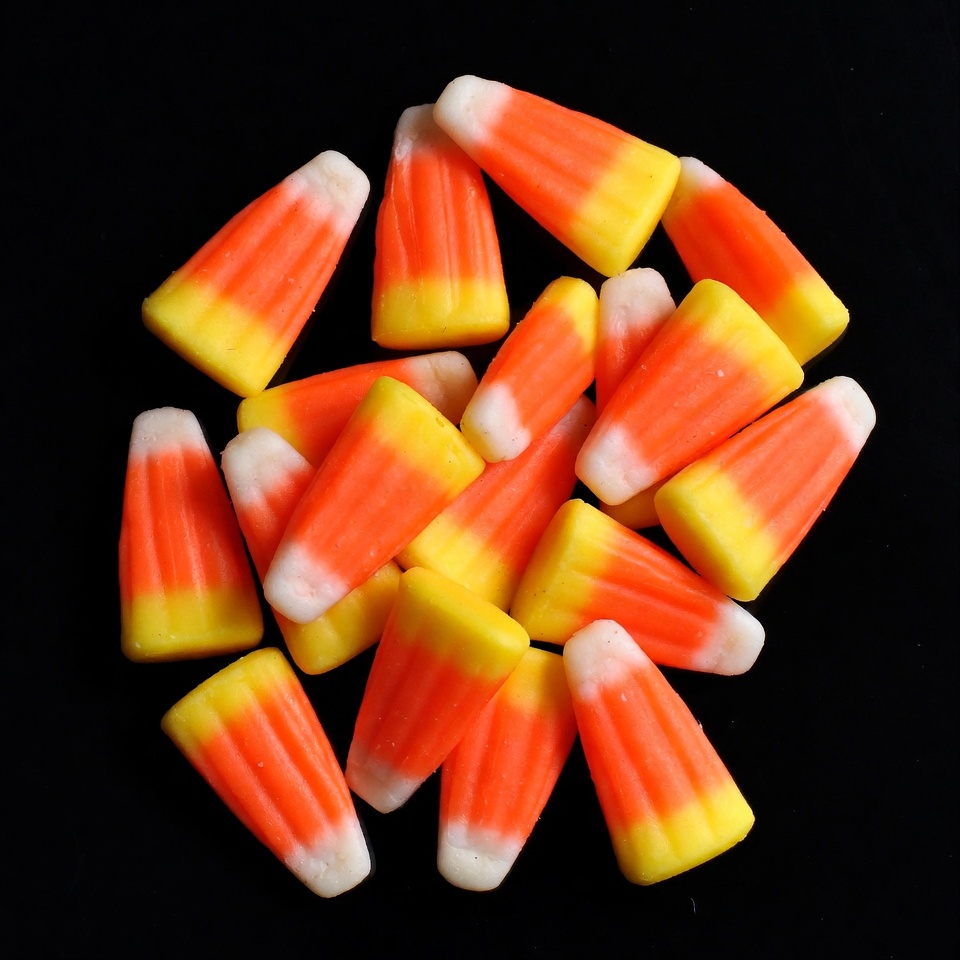 Candy corn pile on black background Candy corn pile on black background