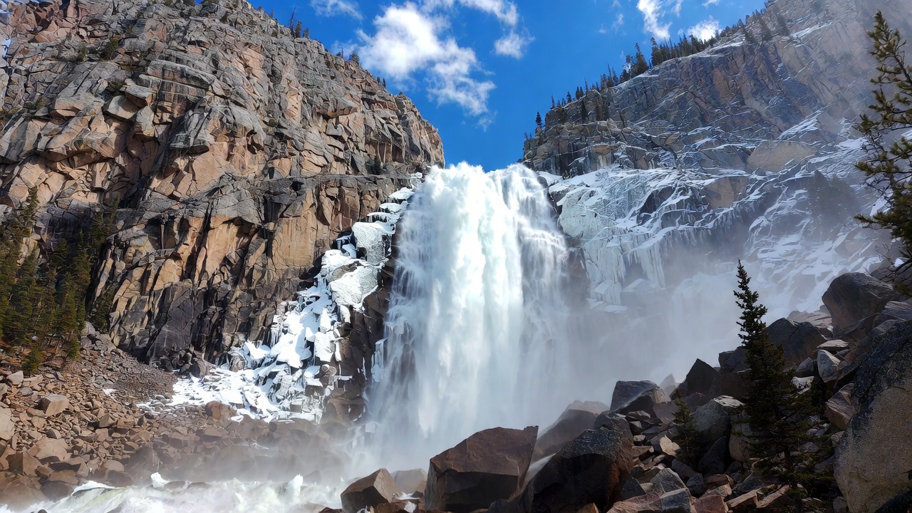 Majestic waterfall cascading snowy mountains Majestic waterfall cascading snowy mountains