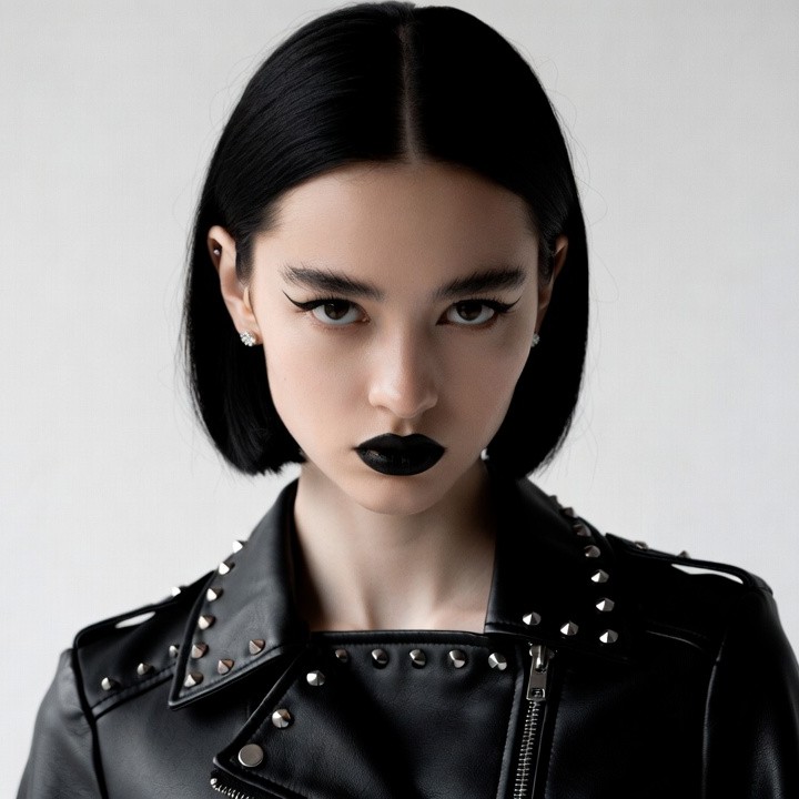 Asian woman in studded leather jacket Asian woman in studded leather jacket