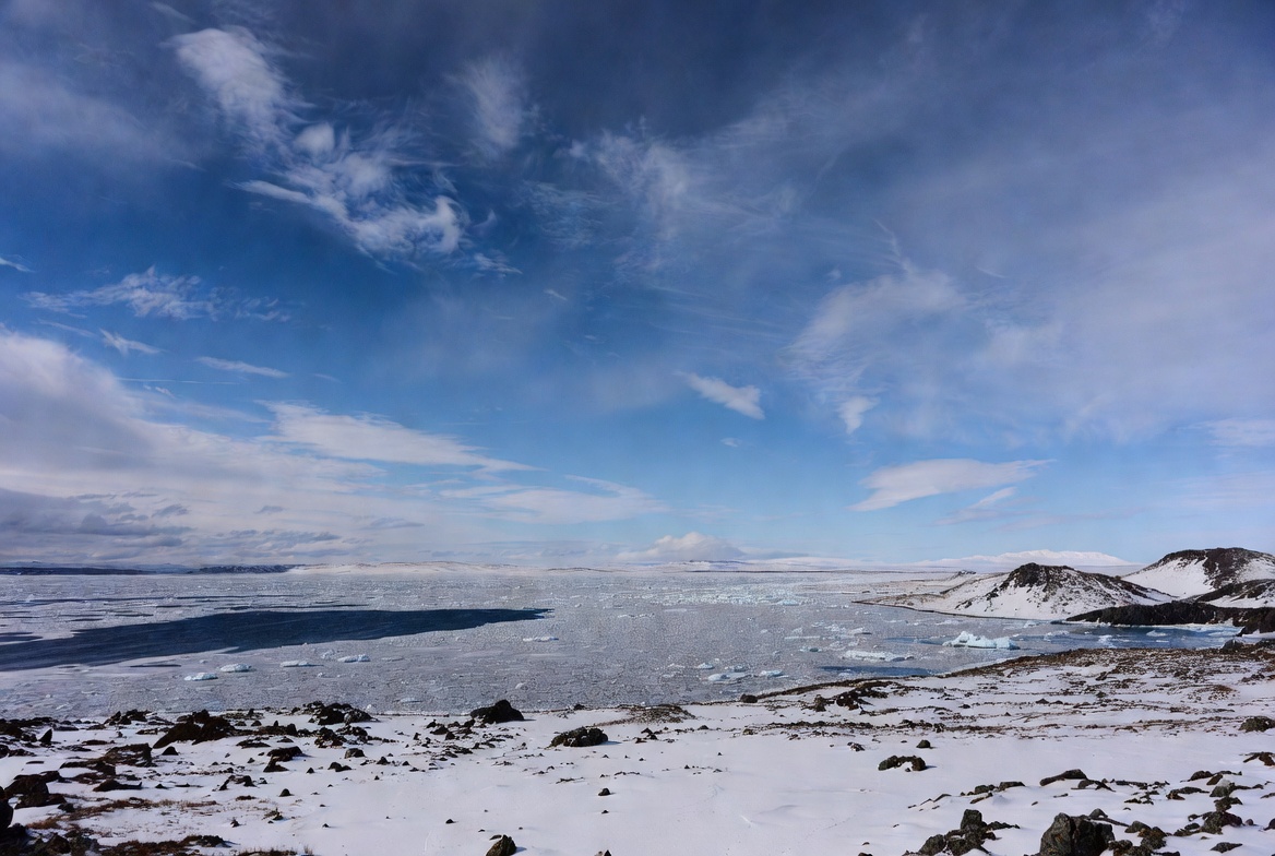 Icy Arctic Landscape with Mountains and Sea Ice Icy Arctic Landscape with Mountains and Sea Ice