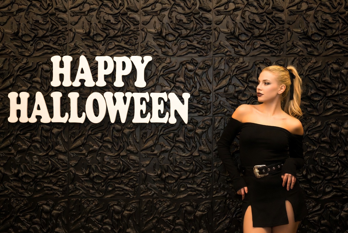 Blonde woman with Happy Halloween sign Blonde woman with Happy Halloween sign