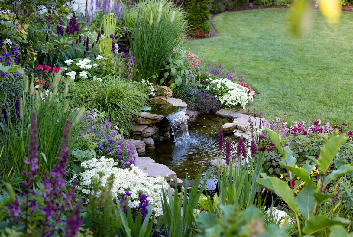 Garden Waterfall with Colorful Flowers Garden Waterfall with Colorful Flowers