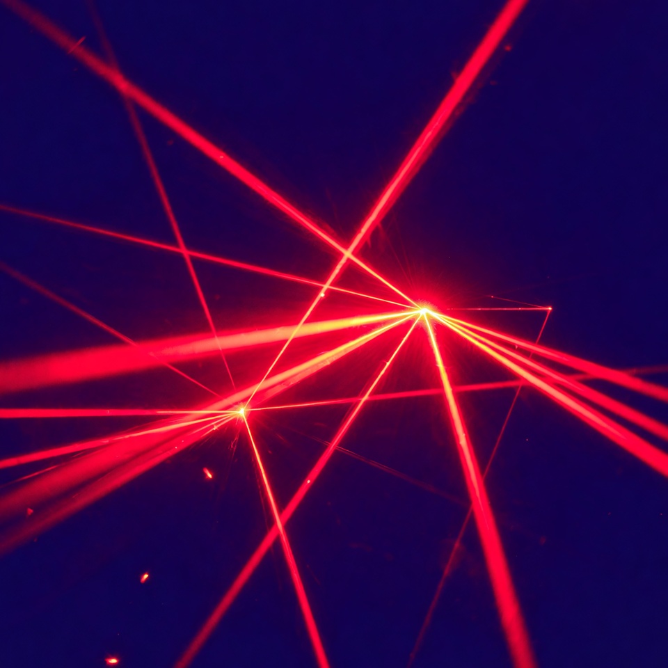 Red laser beams on dark blue background Red laser beams on dark blue background